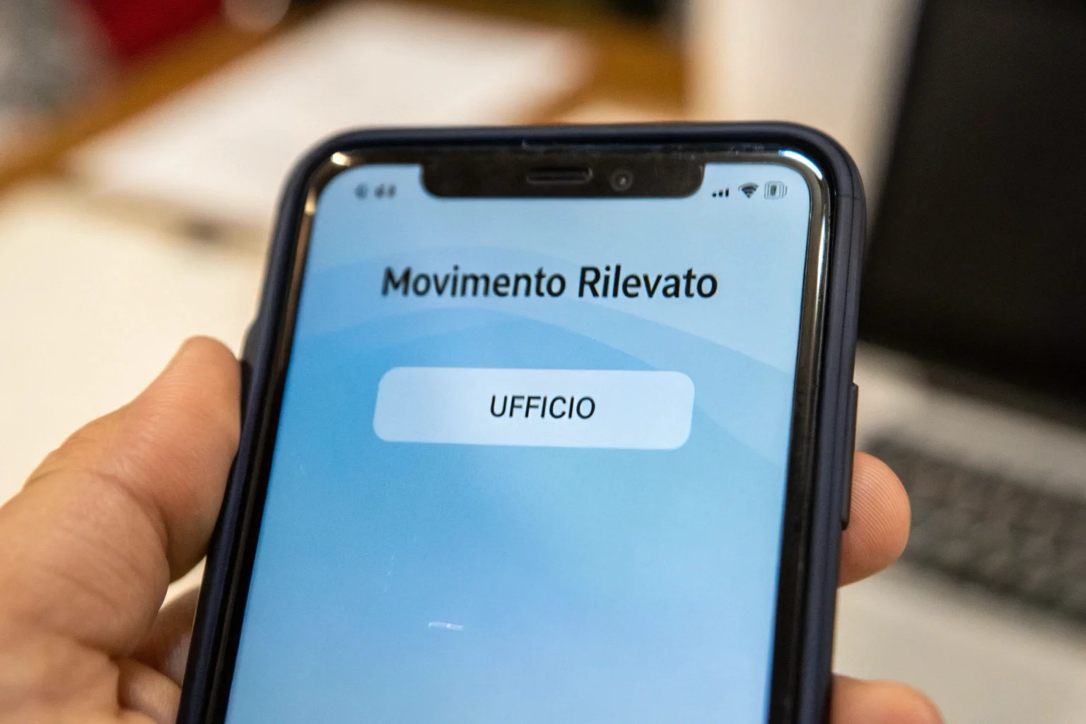 A smartphone screen displaying a motion detection alert from a security camera