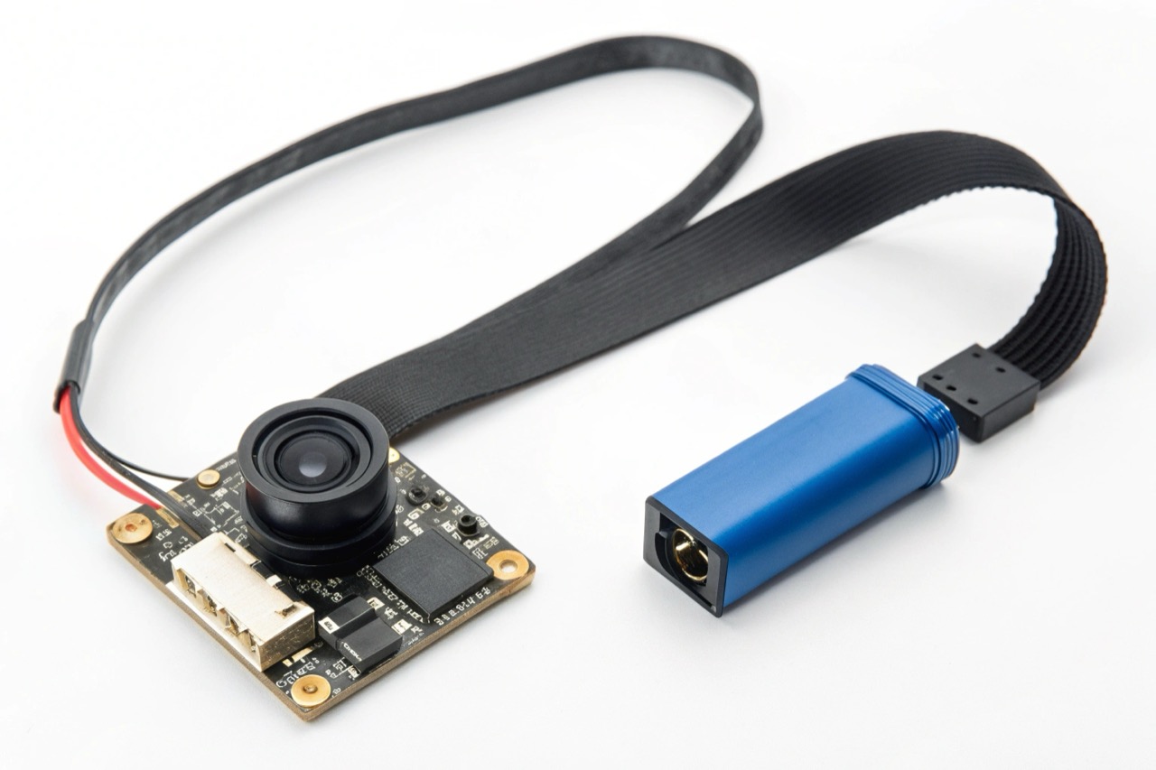 A small DIY camera module with a ribbon cable and battery