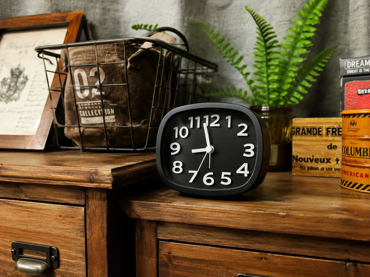 C6 WiFi alarm clock hidden camera placed on an indoor table