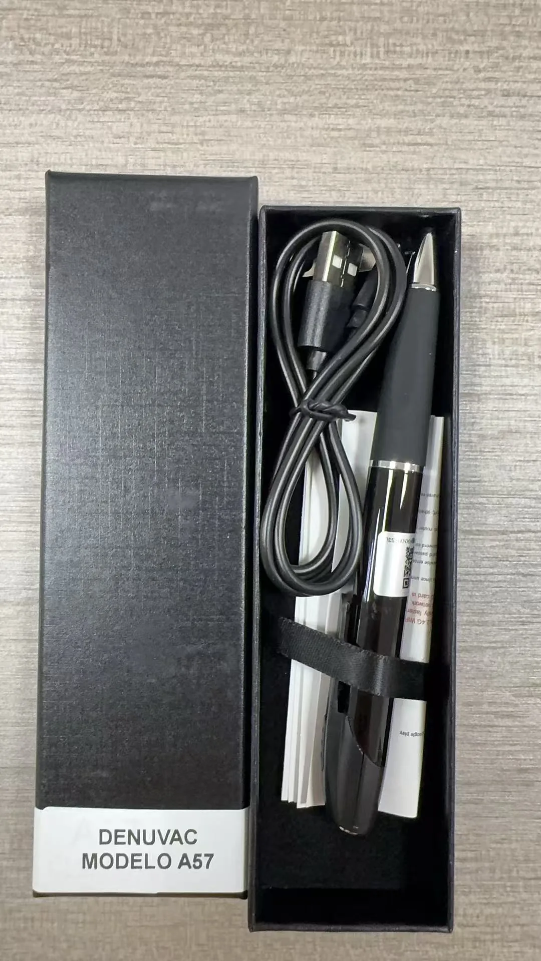 Open A57 WiFi spy pen camera package photographed before shipment