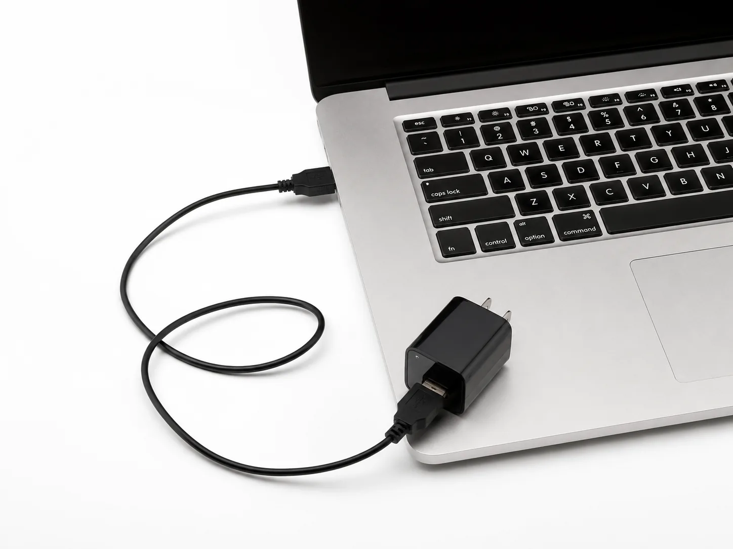 QZT USB charger hidden camera connected near a laptop