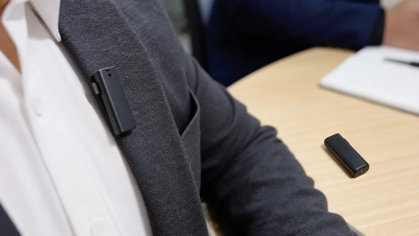 Mini Voice Recorder Placement to Avoid Clothing Noise Mini voice recorder placed on a lapel and meeting table