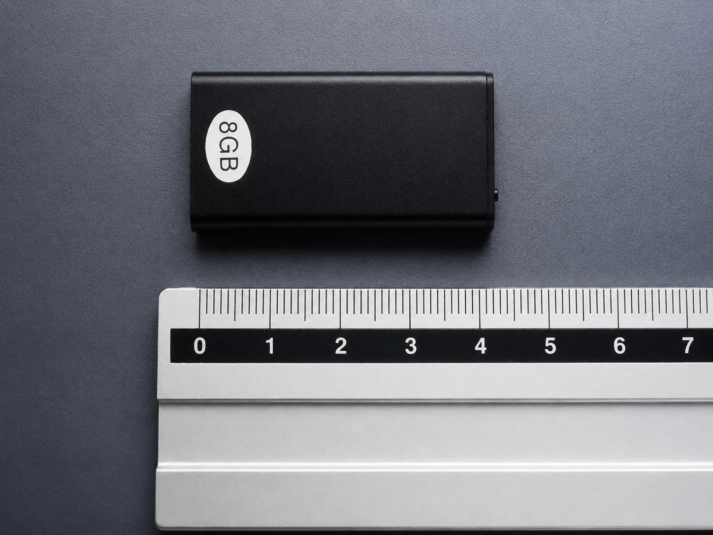 QZT Q1 mini voice recorder size comparison with ruler