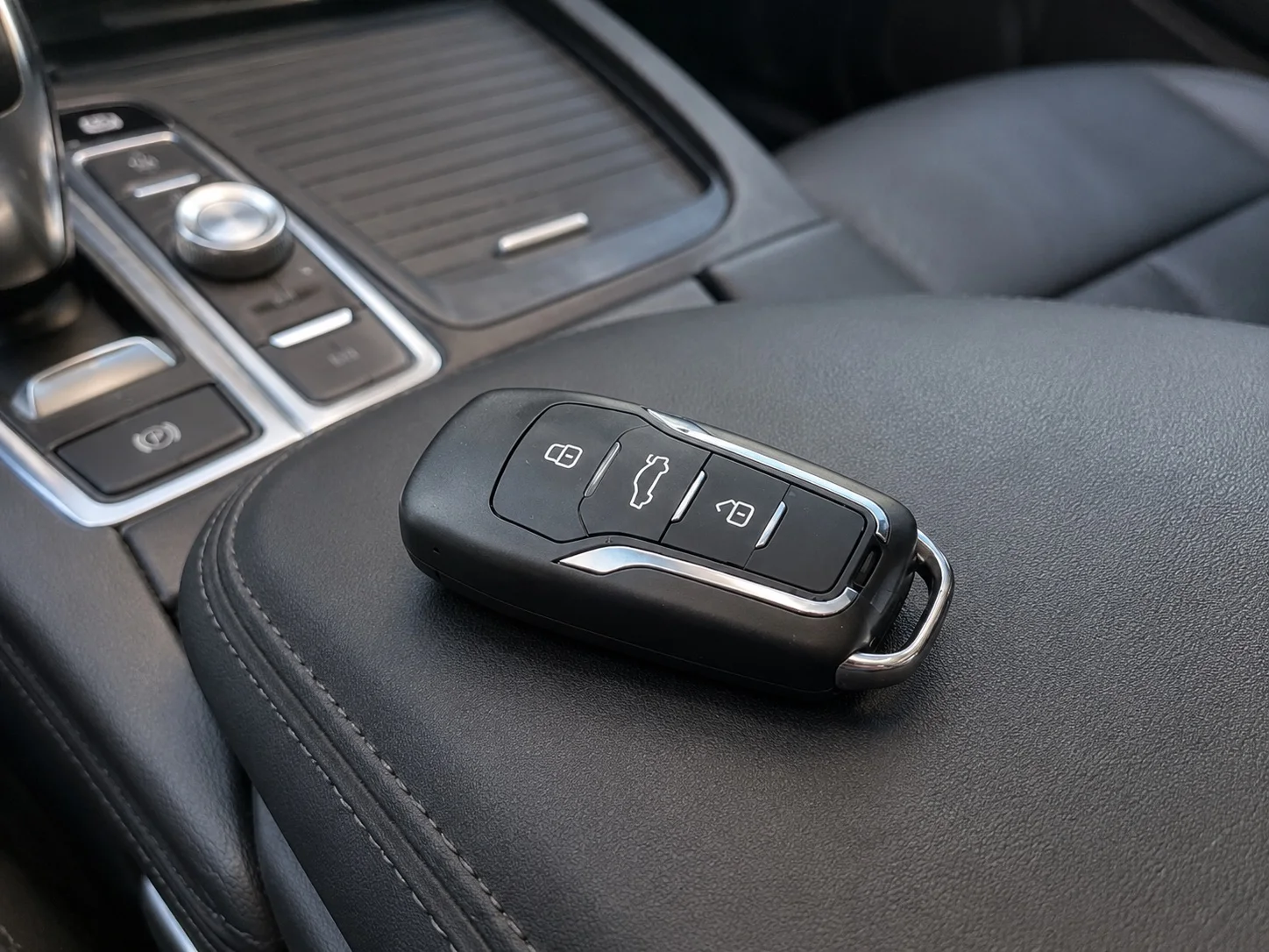 QZT S825 car key spy camera placed inside a vehicle interior