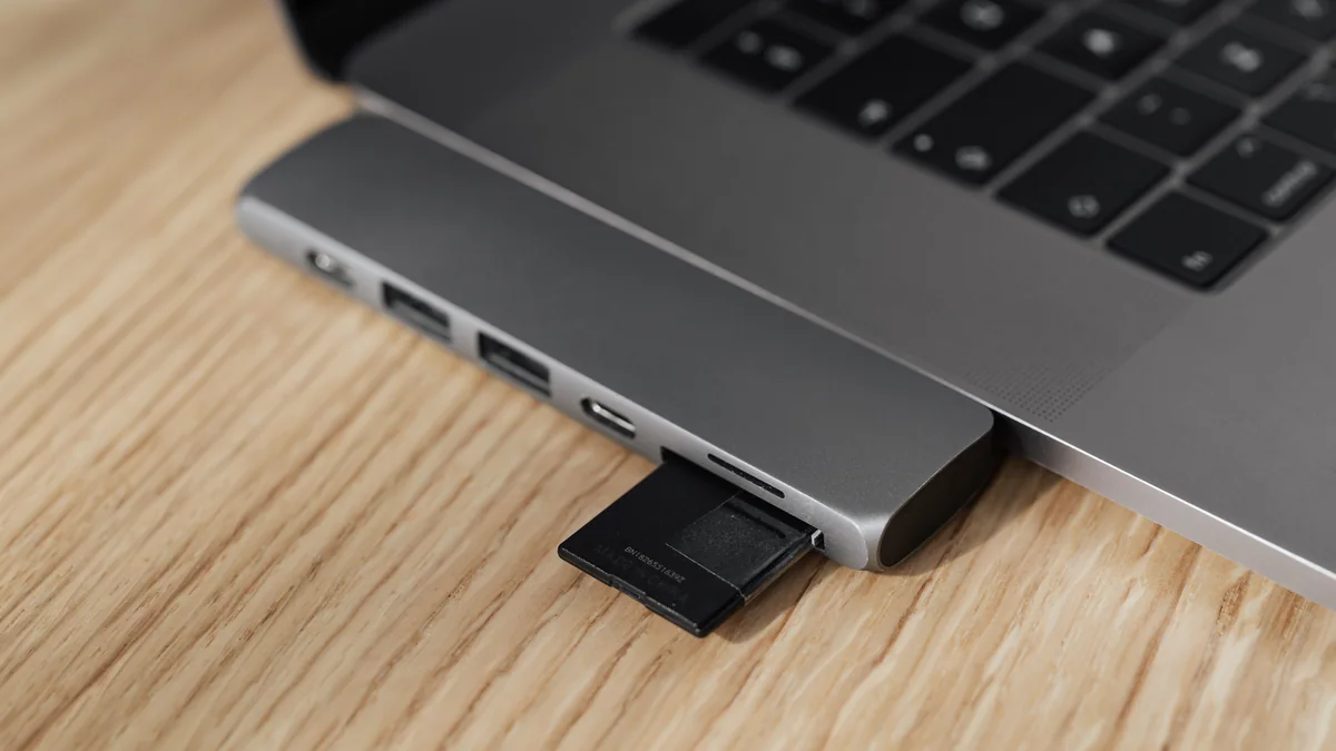 Checking camera recording file size on a laptop Memory card reader connected to laptop for checking recorded file size