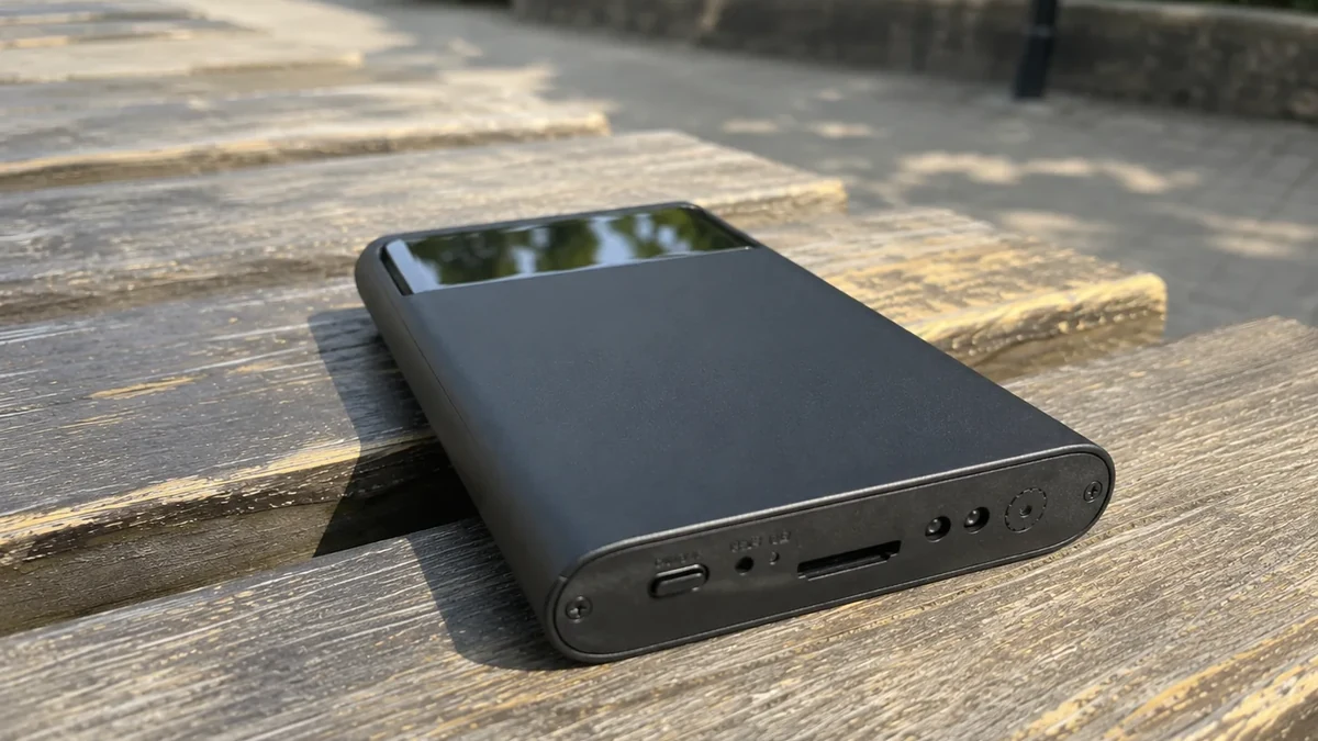 QZT H3 power-bank hidden camera in a real desk scene
