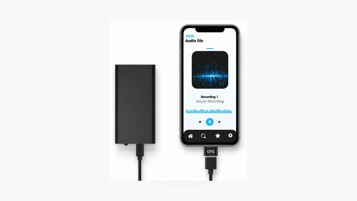 QZT Q1 voice recorder connected to a phone for audio playback