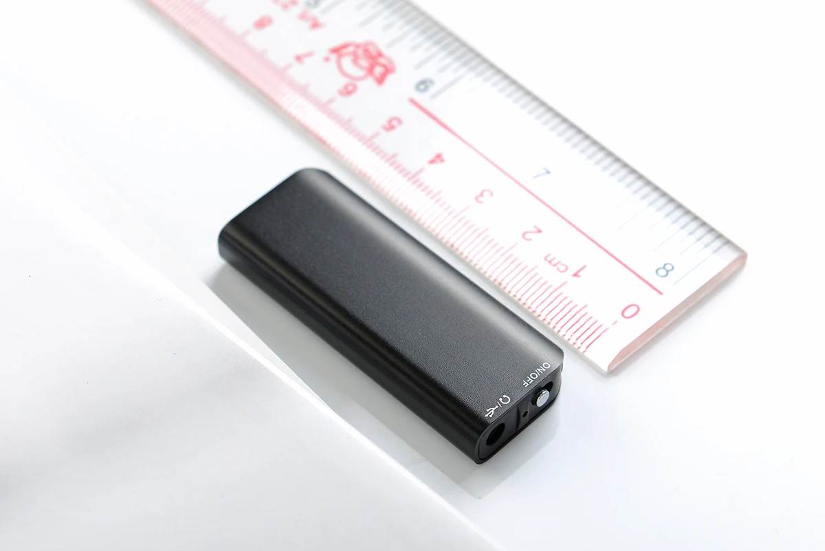 Q23 slim recorder beside a centimeter ruler