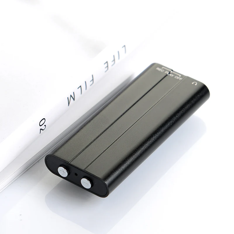 Q50 recorder lying beside a notebook