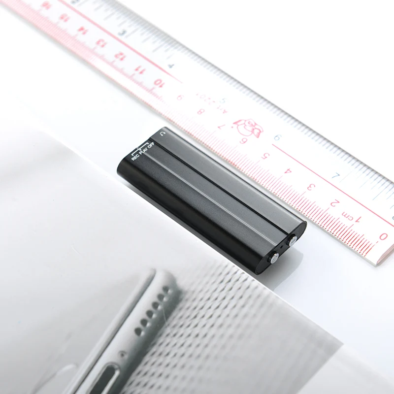 Q50 recorder beside a centimeter ruler