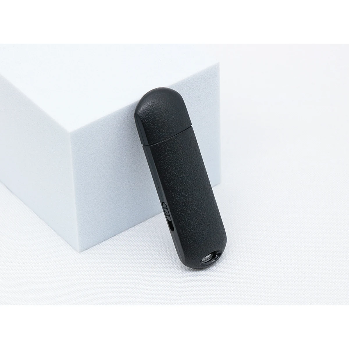 Q62 black USB voice recorder standing beside its cap