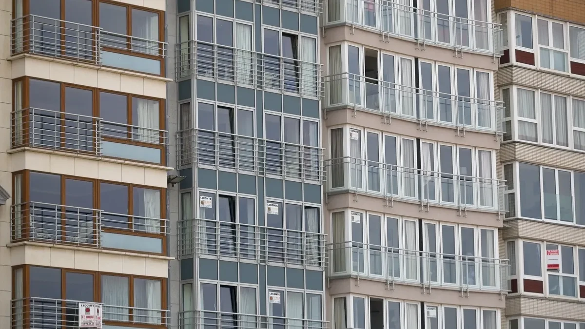 Apartment building facade with rows of windows