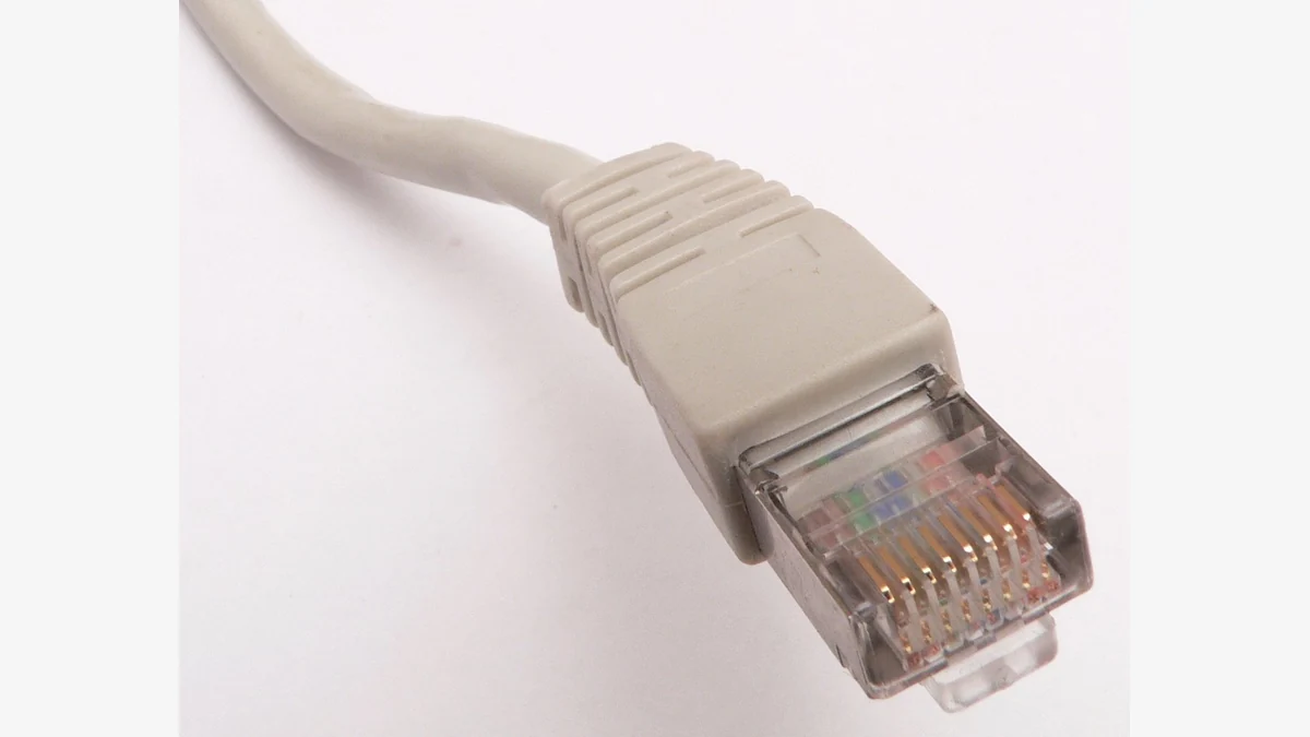 Close-up of the contacts and latch on an RJ45 patch-cable plug