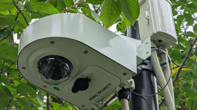 Outdoor dome camera mounted beside a cable junction