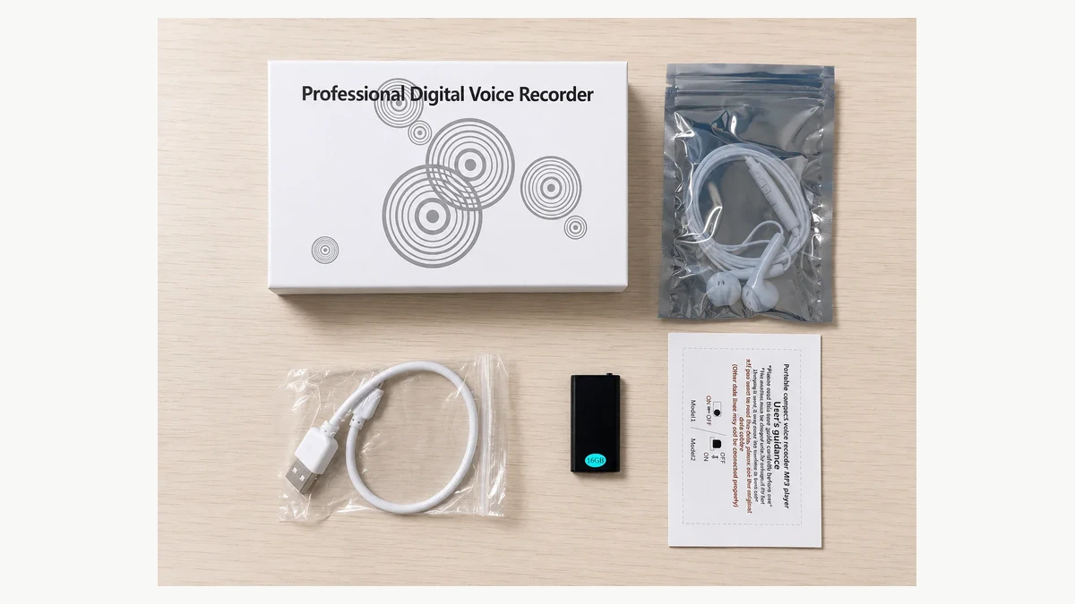 QZT Q1 recorder with its supplied earphones, cable, manual and box