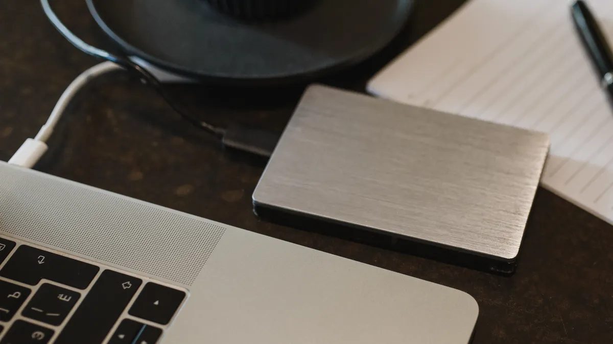 External storage drive connected to a laptop with a USB cable